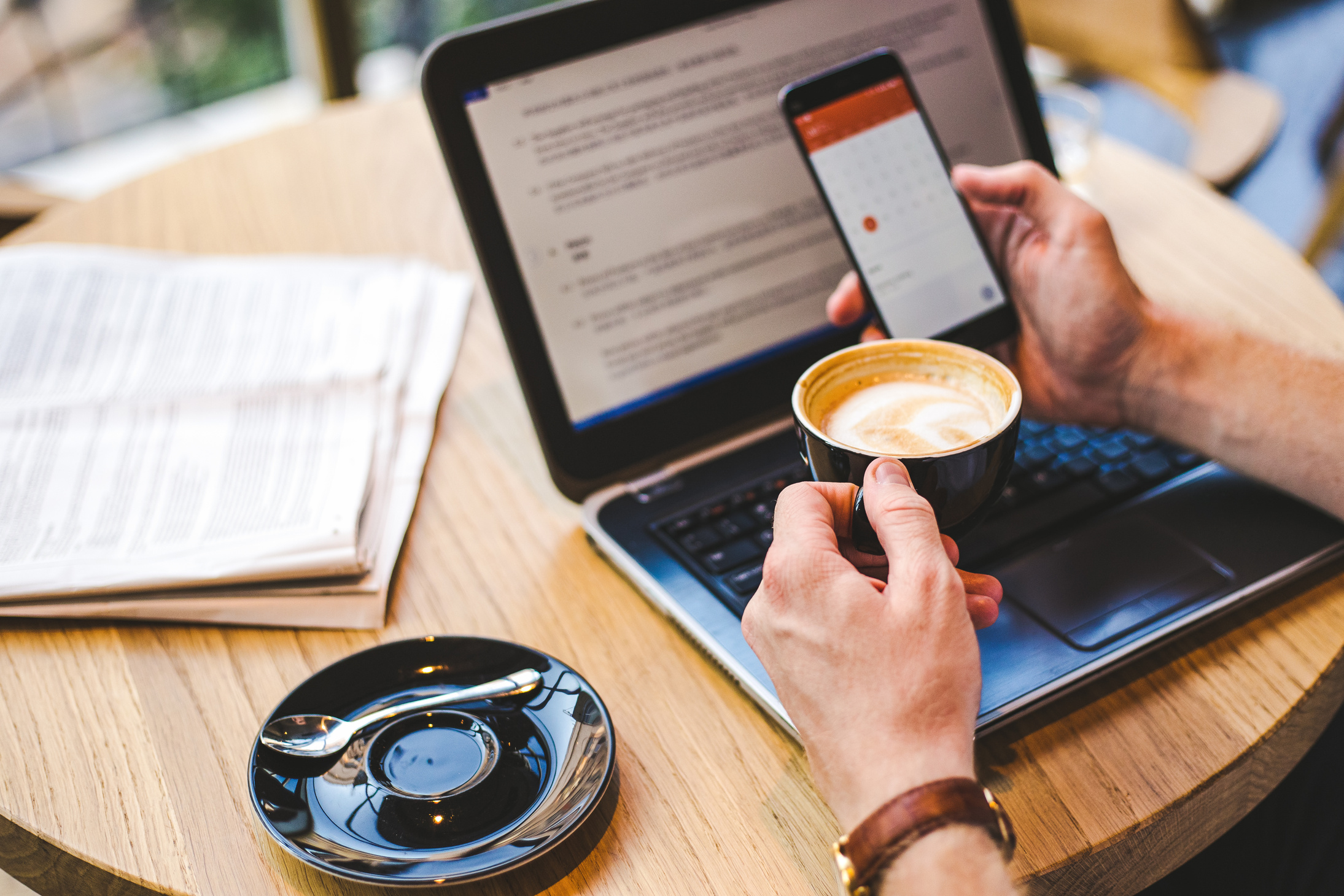 Businessman checking email on smartphone